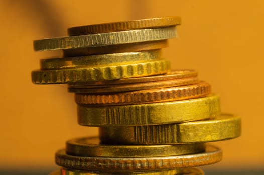 Unstable stack of different coins macro