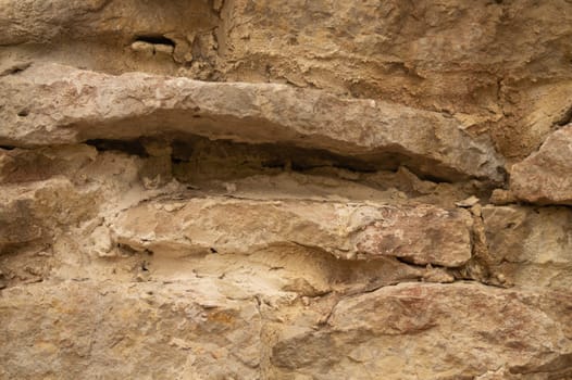 Rocky brick wall. stone wall background. abstract brown grunge texture. old masonry