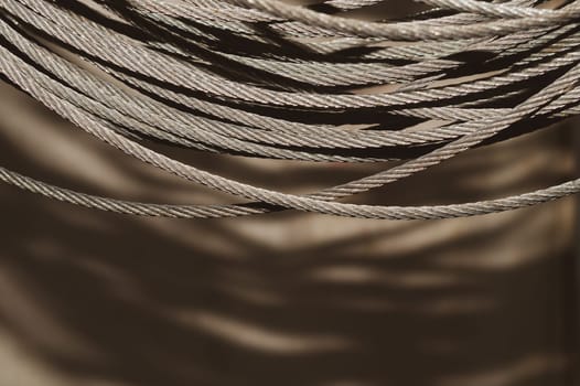 Steel cable. hank of metal rope. working tool