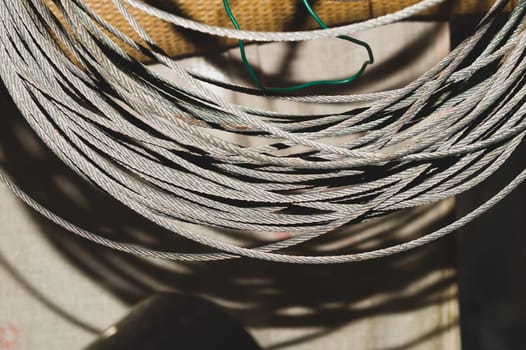 Steel cable. hank of metal rope. working tool