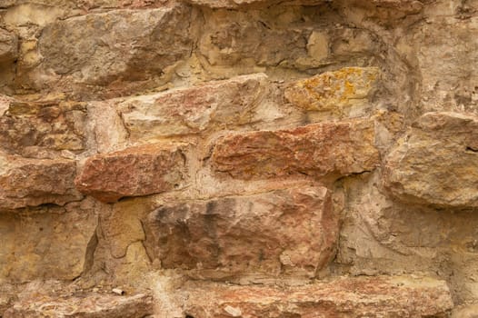 Rocky brick wall. stone wall background. abstract brown grunge texture. old masonry