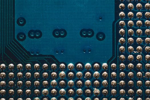 Processor pins macro. computer motherboard close up. cpu pins on a circuit board. micro elements of computer central processor unit. modern technologies abstract background