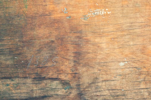 Wood surface with drawn number. old wooden texture. cracked and scratched background
