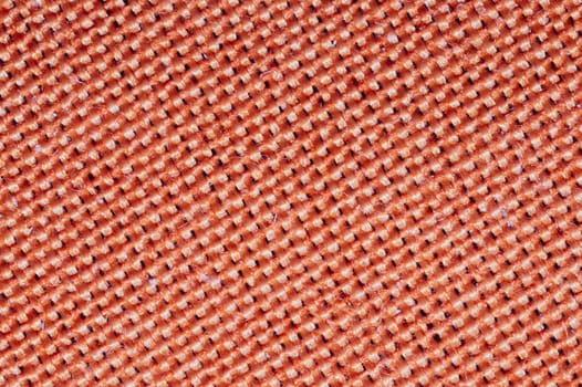Orange fabric texture. knitted textile background. woven material macro