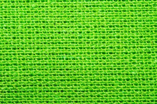 Green textile close up. knitted fabric texture. woven material background