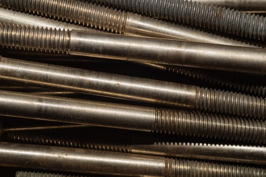 Steel screws close up. bolt thread. fasteners background. work tool