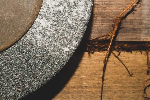 Old rusty grindstone in workshop. whetstone close up
