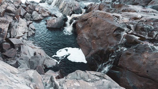 River flows among the rocks. water streaming between the stones