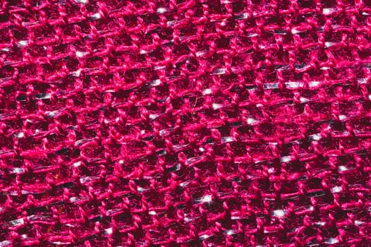 Red fabric texture. knitted textile background. woven material close up