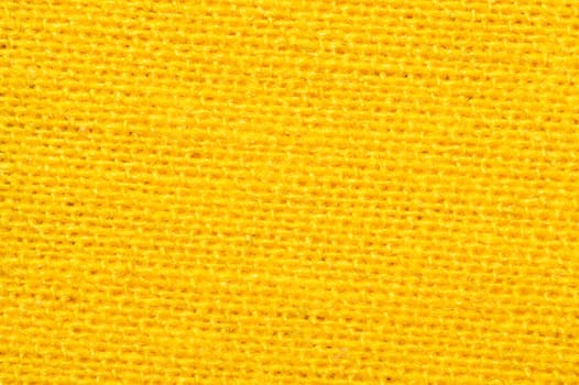 Yellow textile close up. knitted fabric texture. woven material background