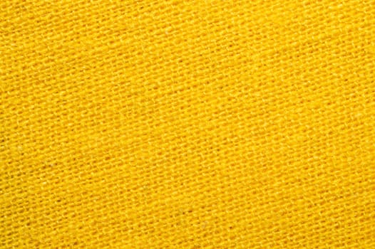 Yellow textile close up. knitted fabric texture. woven material background