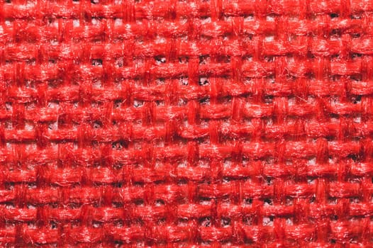 Red fabric texture. knitted textile background. woven material macro