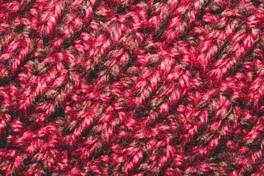Knitted wool texture. fabric material close up. red textile background