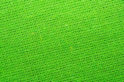 Green textile close up. knitted fabric texture. woven material background