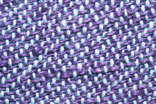 Fabric macro texture. knitted material close up. woven background. woolen textile