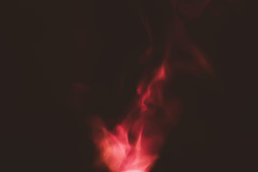 Red smoke on black backdrop. color fog abstract background