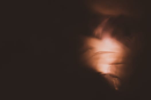 Colored smoke on black backdrop. brown fog abstract background