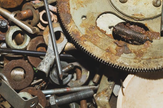 Pile of fasteners and screws close up. scrap metal. different metal parts