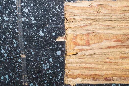 Painted wood surface with spots. wooden background with paint splashes. grunge texture with stains and scratches