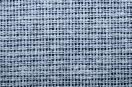 Fabric macro texture. knitted textile close up. woven background. woolen material