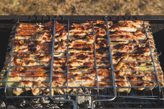 Grilled meat. barbeque on metal grille. picnic with bbq. outdoor cooking
