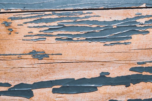 Rough wood texture with peeling paint. old wooden texture with cracked paint close up