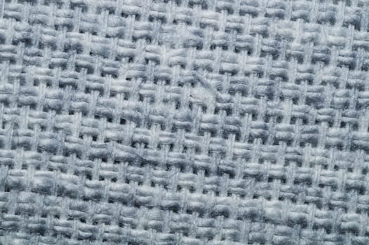Fabric macro texture. knitted textile close up. woven background. woolen material