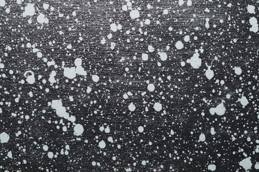 Painted wood surface with spots. wooden background with paint splashes. grunge texture with stains and scratches
