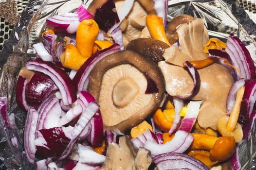 Marinated mushrooms with fresh onion in a bowl. pickled appetizer