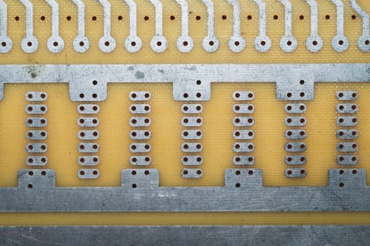 Printed circuit board without elements. textolite surface. template for soldering the circuit. perforated background