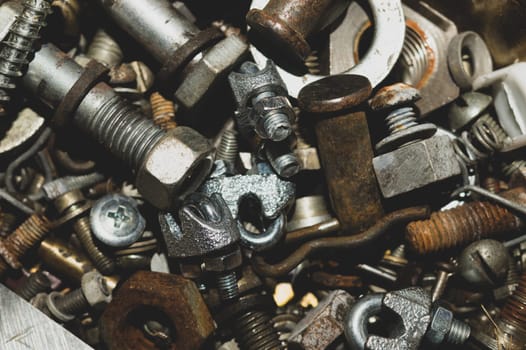 Old screws background. heap of tapping screws. work tool. pile of fasteners. bolts and nuts. metal scrap