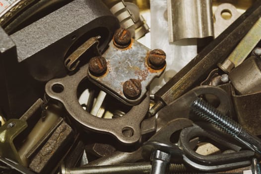 Pile of fasteners and screws close up. metal scrap. different metal details