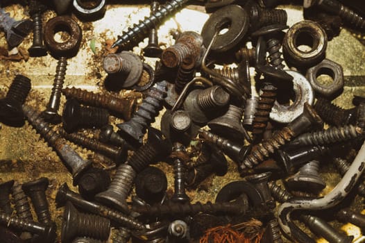 Screws background. heap of tapping screws. work tool. pile of fasteners