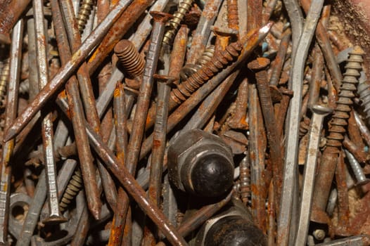 Screws background. heap of tapping screws. work tool. pile of fasteners