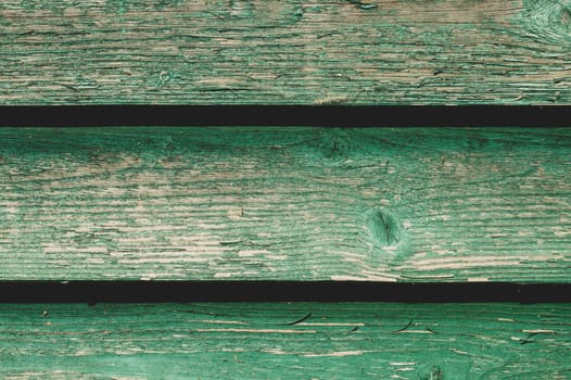 Colored wood texture. green wooden planks. shabby painted wood background