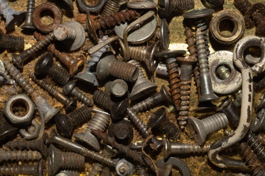 Screws background. heap of tapping screws. work tool. pile of fasteners