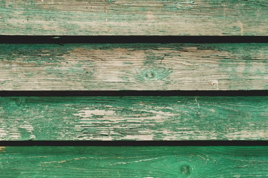Colored wood texture. green wooden planks. shabby painted wood background