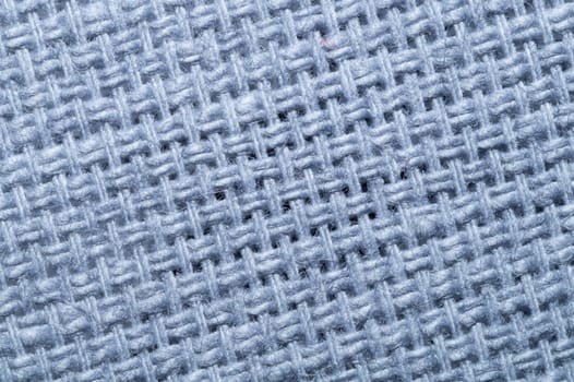 Fabric macro texture. knitted textile close up. woven background. woolen material