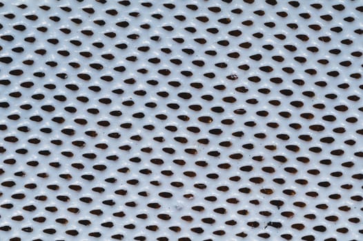 Rubber surface with uneven holes. white plastic texture with dots. abstract background