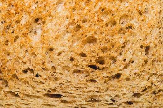 Sliced bread texture. piece of wheat bread close up