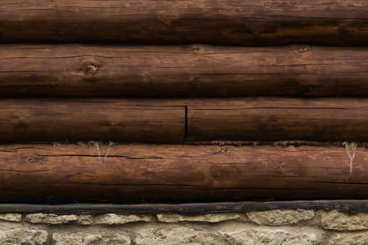 Wall of logs. wood background. rural house exterior