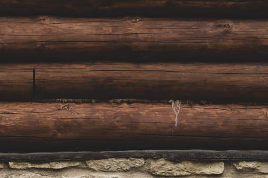 Wall of logs. wood background. rural house exterior