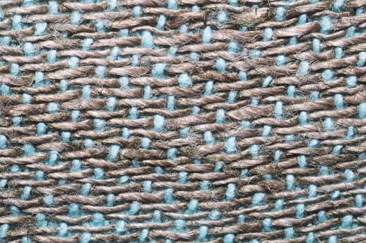 Fabric macro texture. knitted material close up. woven background. woolen textile