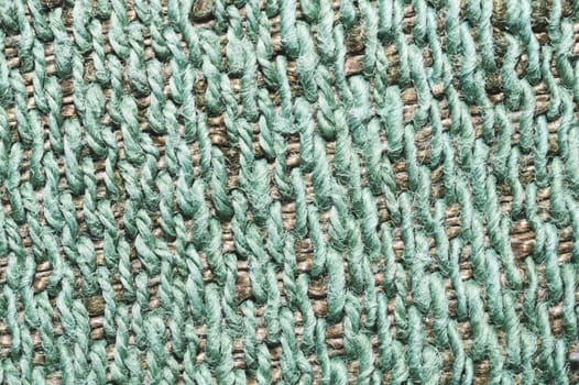 Fabric macro texture. knitted material close up. woven background. woolen textile