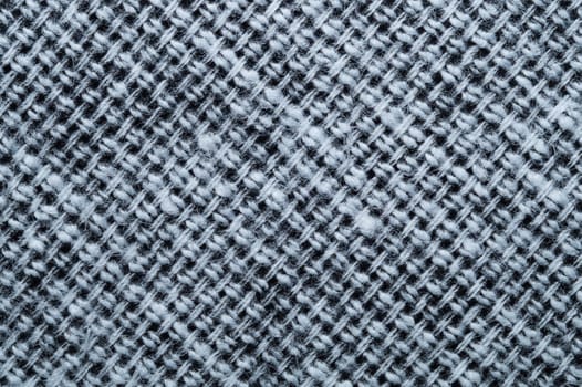 Fabric macro texture. knitted textile close up. woven background. woolen material