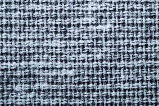 Fabric macro texture. knitted textile close up. woven background. woolen material