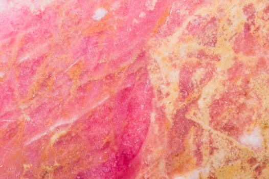 Red granite texture. pink marble background. flat stone surface close up