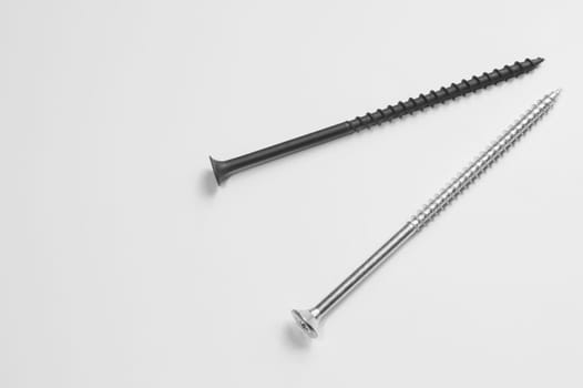 Steel screw on a white background. working tools
