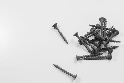 Steel screw on a white background. working tools