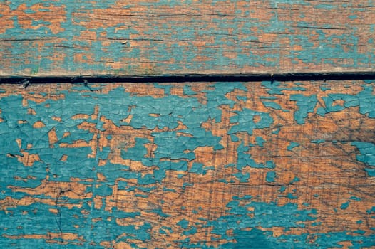 Wooden texture with cracked paint. shabby wood background close up